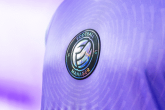 Close up of a player's chest in a lavender purple shirt, showing a Football Manager FC club badge in the middle