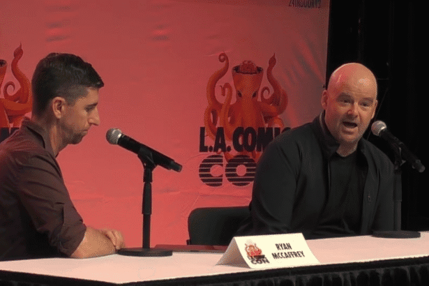 Ryan McCaffrey sat next to Dan Houser at a table.