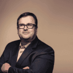 Reid Hoffman predicts NFTs' resurgence driven by AI trends.