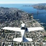 A small white plane flies over downtown San Francisco and the Golden Gate Bridge in a flight simulator