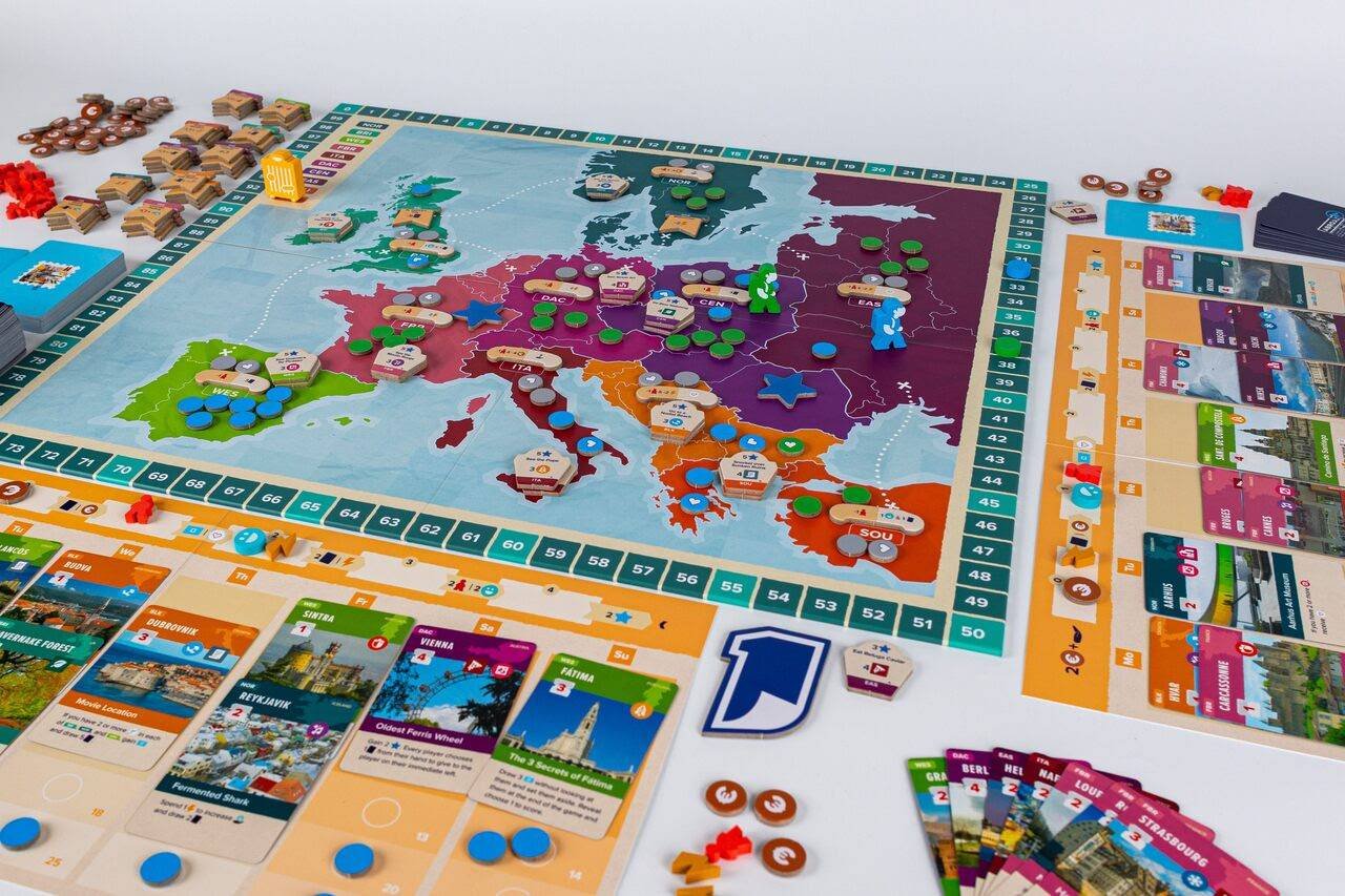 The game board and components for Abroad include a map of Europe and cards representing different places to visit