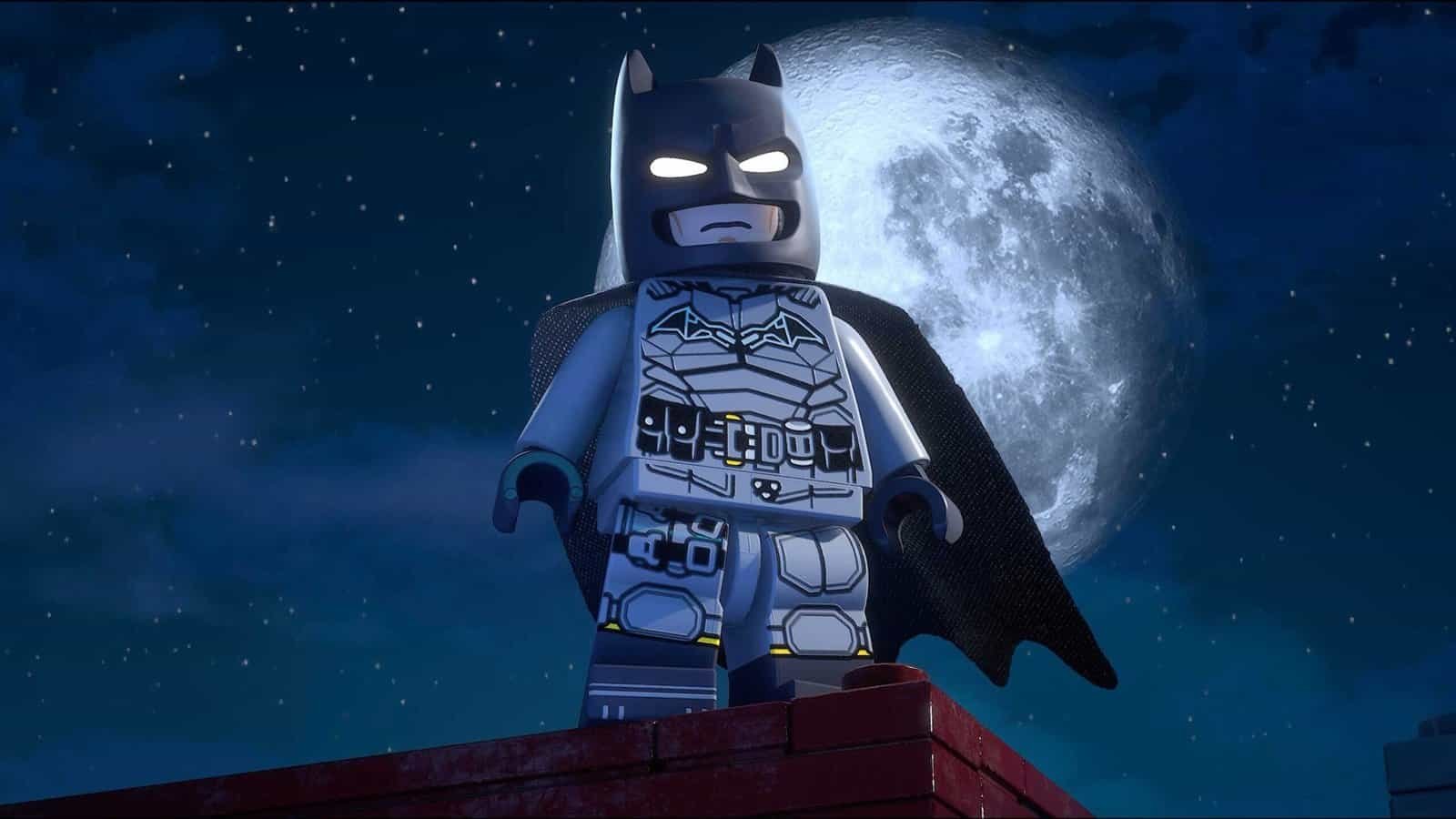 Batman stands on a building in Lego Batman Legacy of the Dark Knight