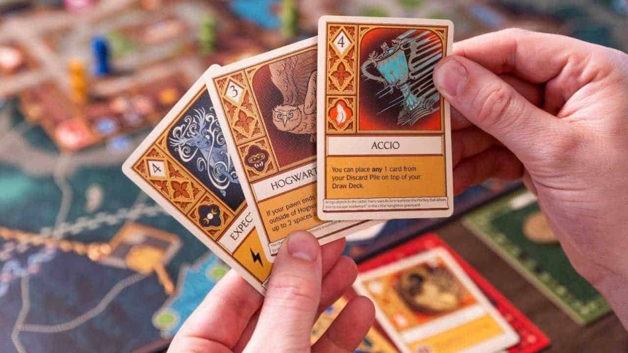 Someone holding cards in Harry Potter: Defenders of Hogwarts.