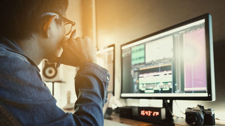 A person working in a video editor sweet on a PC