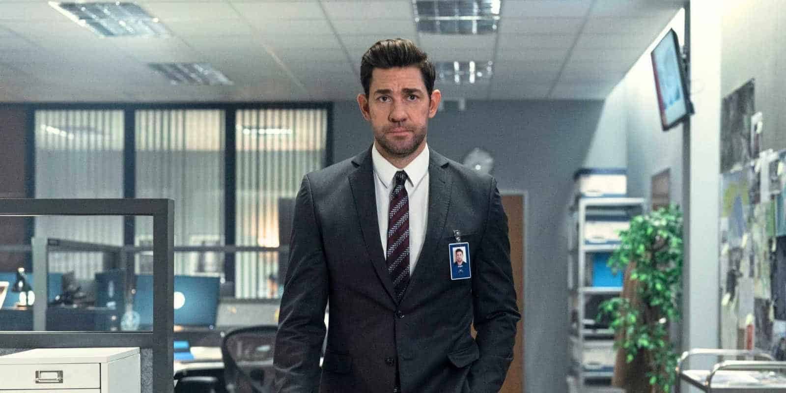 John Krasinski in a suit walking towards the camera in Jack Ryan