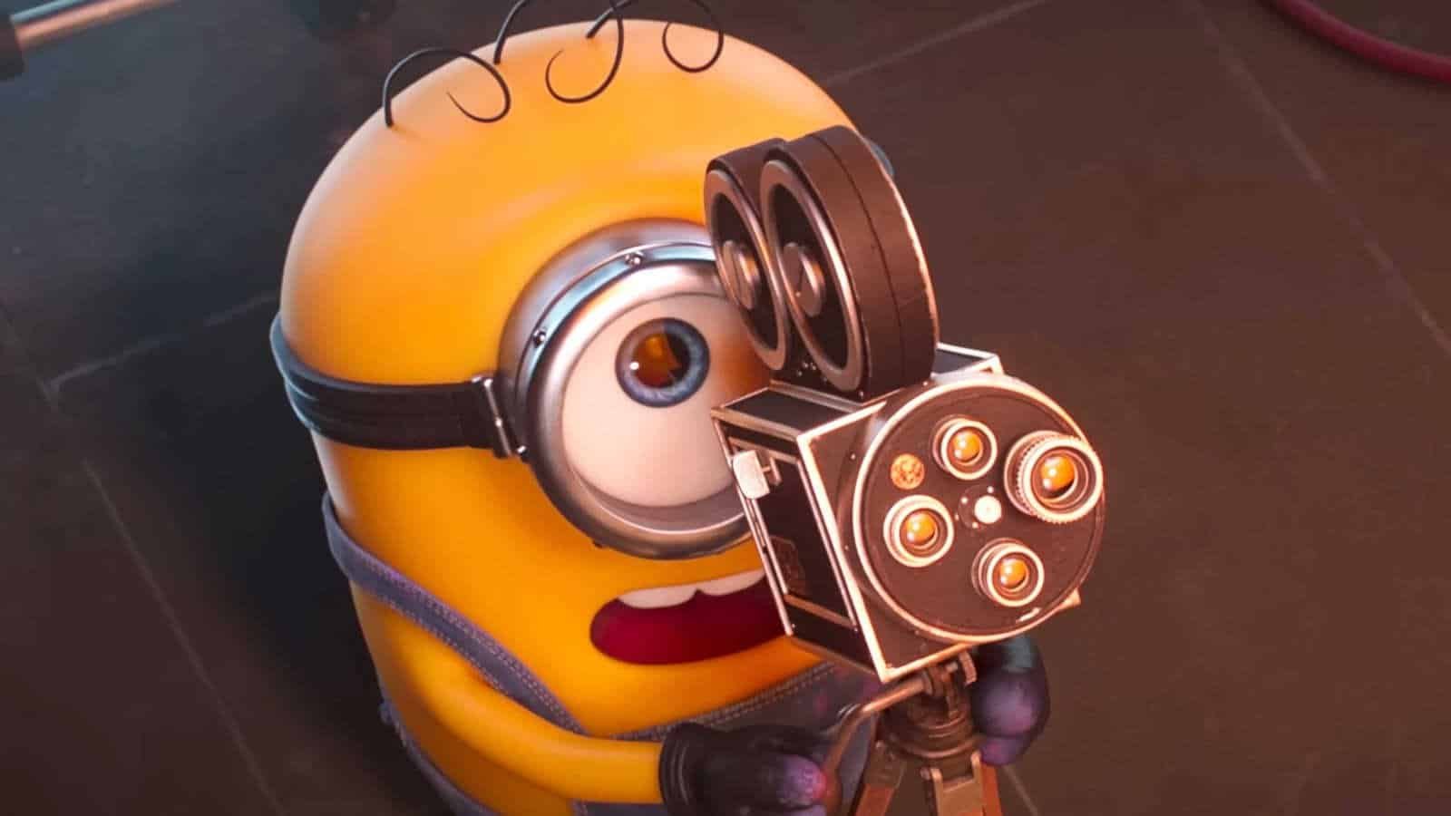 James looking up in shock while pointing a camera in Minions & Monsters
