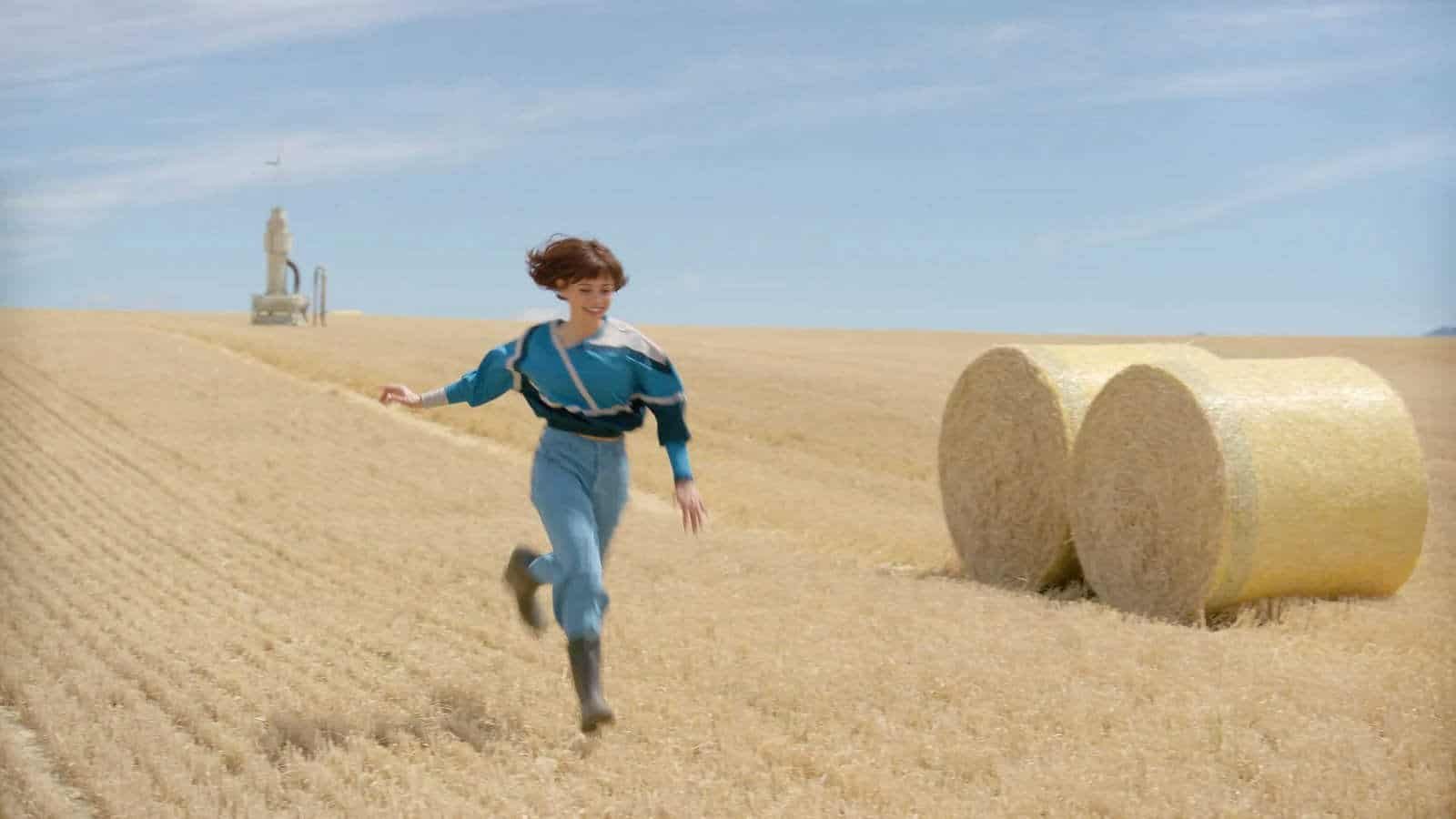 Jenna Ortega's Klara running through a field in Klara and the Sun