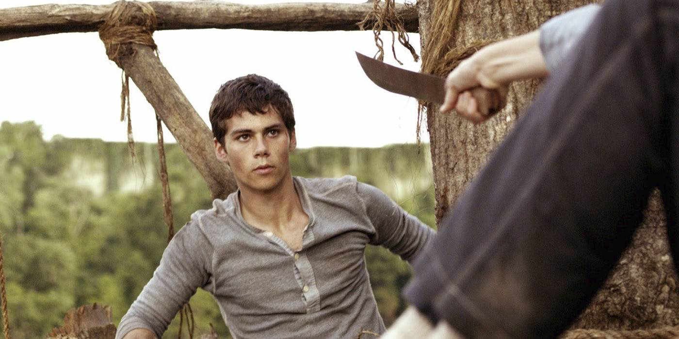 Thomas from Maze Runner threatened with a knife