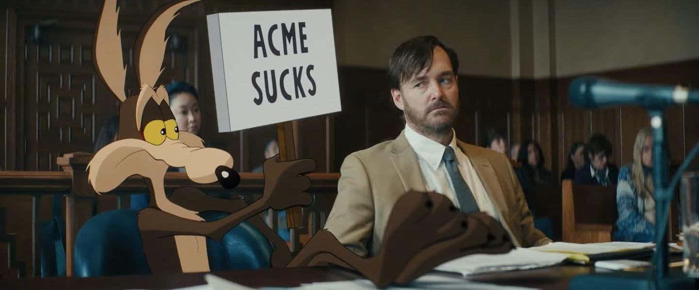 Wile E. Coyote hold a sign that reads "ACME sucks"