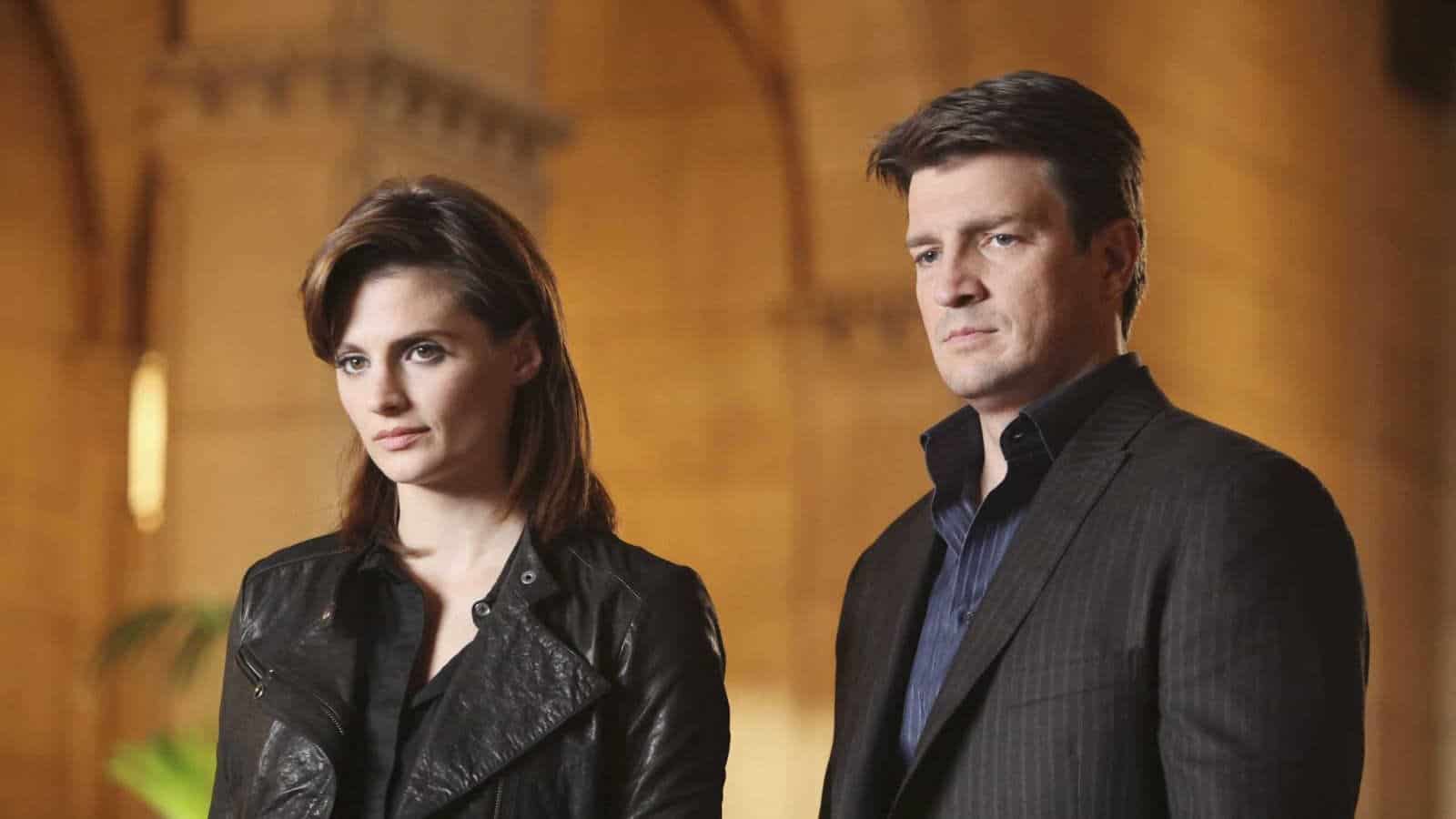 Kate (Stana Katic) and Castle (Nathan Fillion) looking unimpressed with someone in Castle.