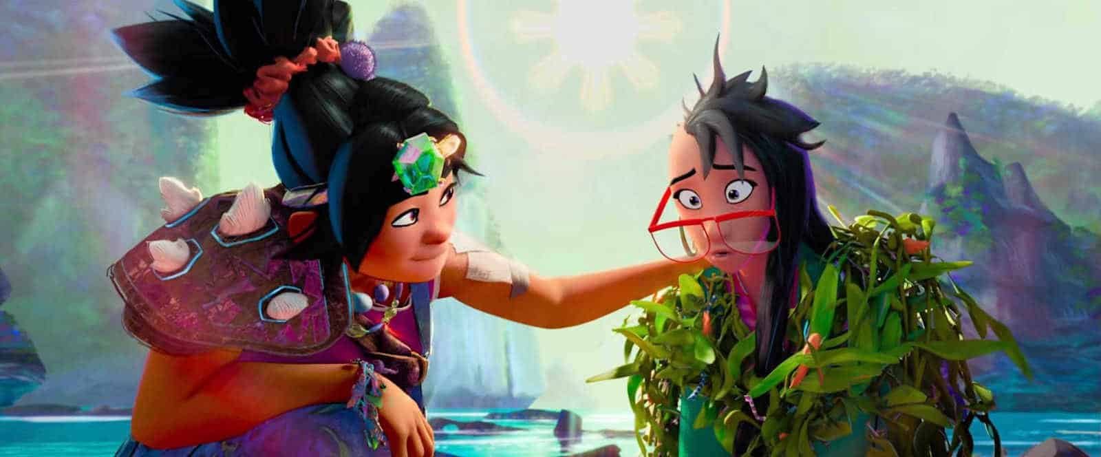 A girl with her hair pulled up in a topknot, wearing a Bowser-style spiked turtle shell, comforts her friend, a girl with long, dark hair shaved on one side, and big red glasses sliding down her nose, in Forgotten Island