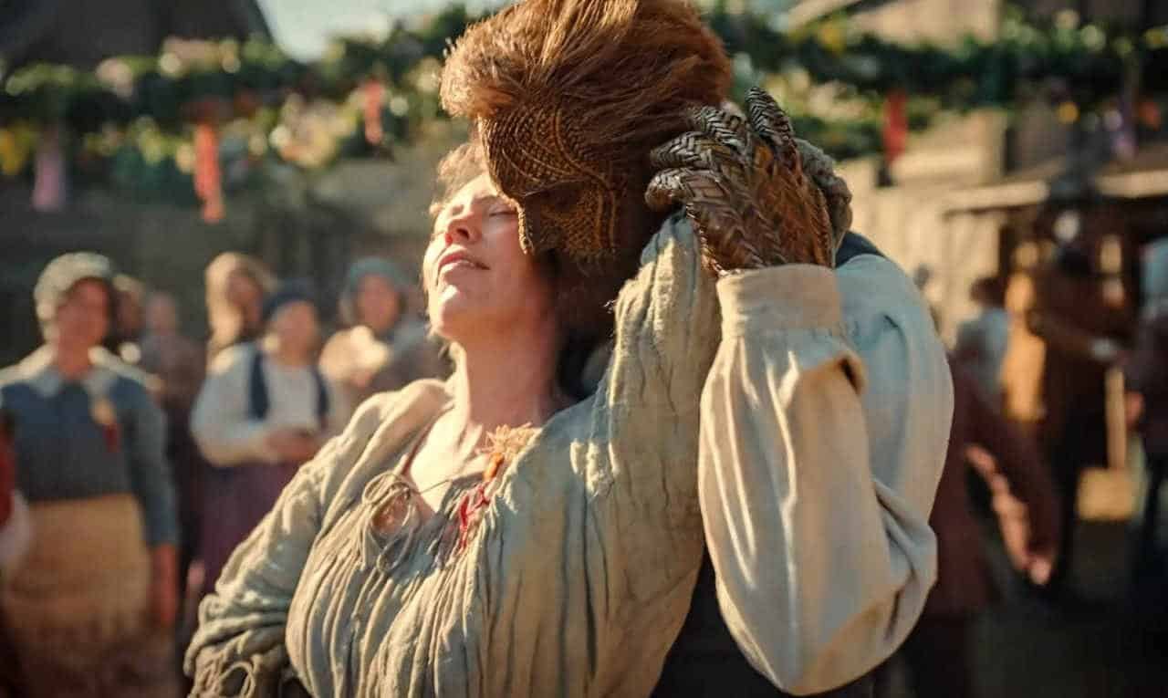 A handsome wicker man nuzzles Olivia Colman in Wicker
