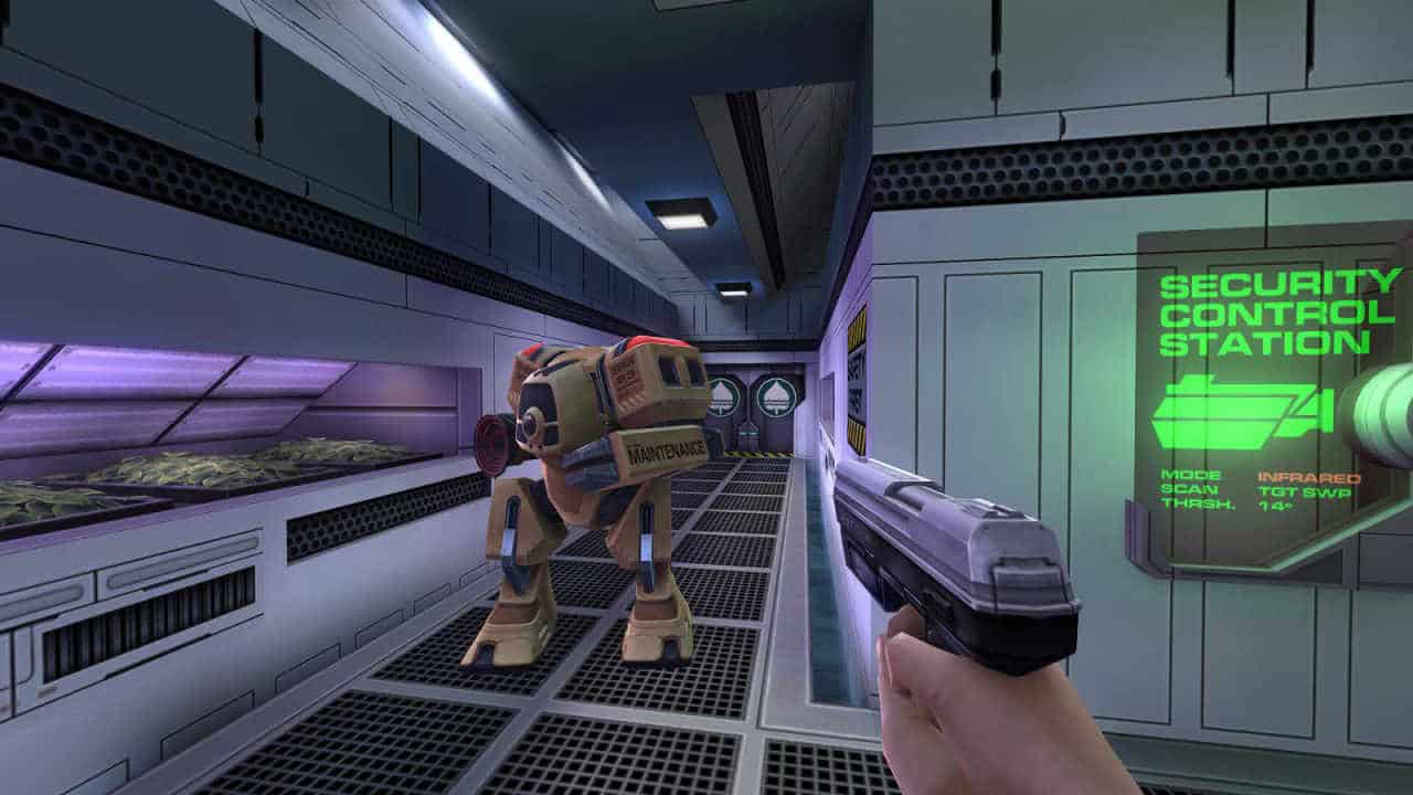 System Shock 2 player pointing a gun at a robot enemy in a gray hallway